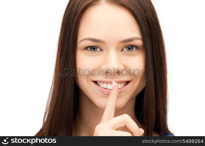 bright picture of young woman with finger on lips