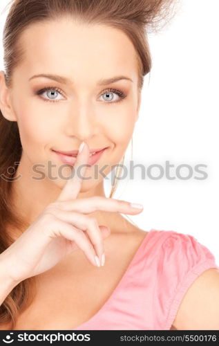 bright picture of young woman with finger on lips