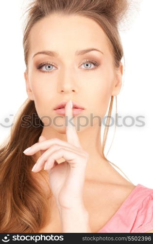 bright picture of young woman with finger on lips