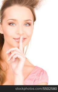 bright picture of young woman with finger on lips