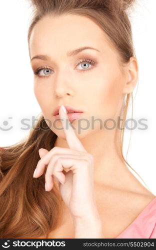 bright picture of young woman with finger on lips