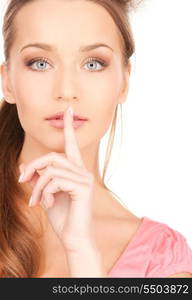 bright picture of young woman with finger on lips