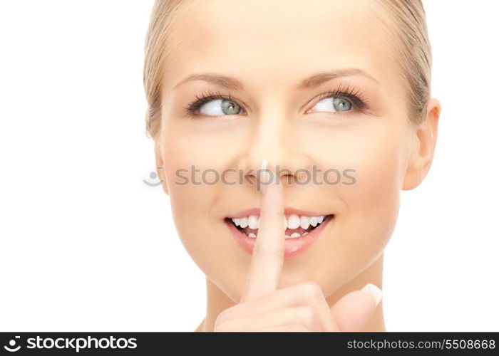 bright picture of young woman with finger on lips