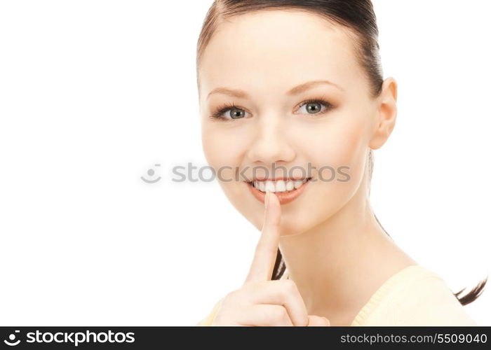 bright picture of young woman with finger on lips