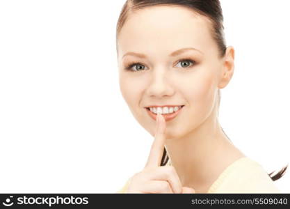 bright picture of young woman with finger on lips