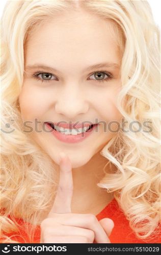 bright picture of young woman with finger on lips