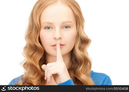 bright picture of young woman with finger on lips