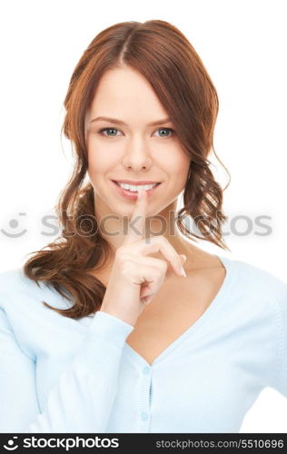 bright picture of young woman with finger on lips