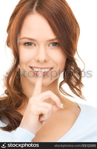 bright picture of young woman with finger on lips