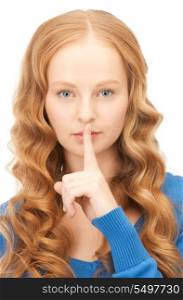 bright picture of young woman with finger on lips&#xA;