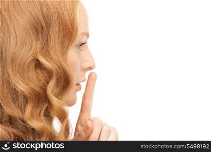 bright picture of young woman with finger on lips&#xA;