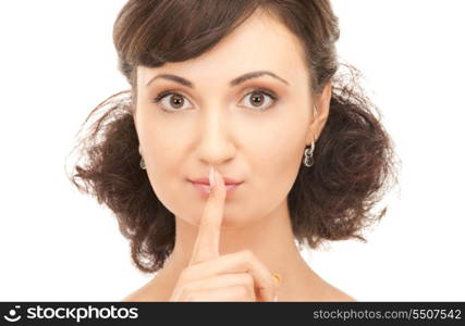 bright picture of young woman with finger on lips&#xA;