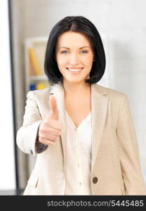 bright picture of young woman with thumbs up