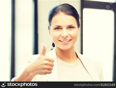 bright picture of young woman with thumbs up. thumbs up
