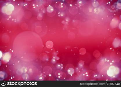 Bright pink red bokeh background. Blurred abstract holiday or event background.