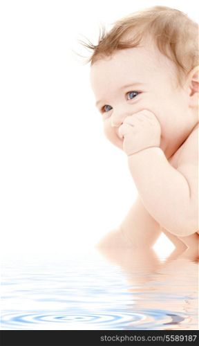 bright portrait of adorable baby in water