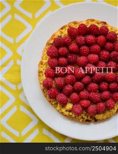 bright raspberry cake on yellow napkin with the words delicious.. bright raspberry cake on yellow napkin with the words delicious