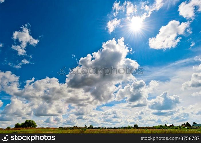 bright rays of the sun over the yellowed field