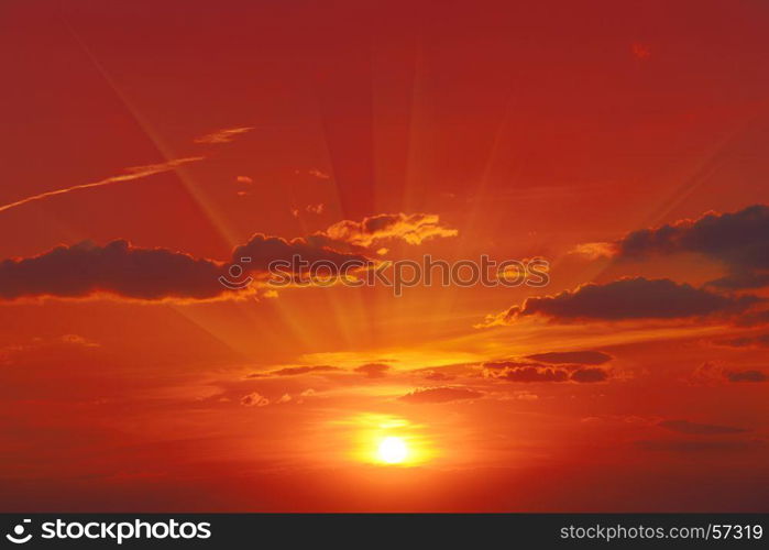 Bright red sunrise in the dark sky