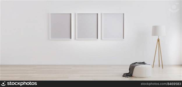 Bright room interior with three empty frames for mockup with wooden floor l&, white pouf and wooden floor with white wall. Picture or poster frames on white wall. White bright wall mockup. 3d rendering
