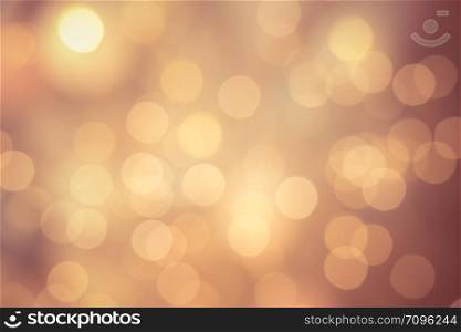 Bright round bokeh on vivid champagne color background