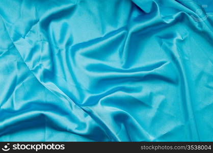 Bright satin fabric folded to be used as background