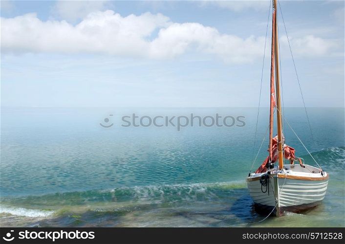 Bright seaside background with sailing boat.