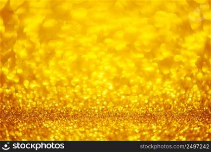 Bright shiny festive golden glitter soft golden bokeh background