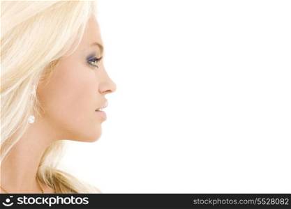 bright sideview picture of lovely blonde in diamond earring