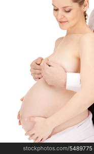 bright studio picture of beautiful pregnant woman