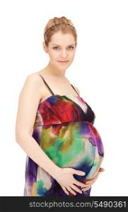 bright studio picture of beautiful pregnant woman