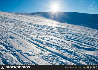 Bright sun in winter mountains covered with snow.