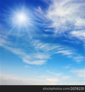 Bright sun on blue sky with beautiful white clouds