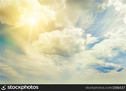 Bright sun on blue sky with beautiful white clouds.