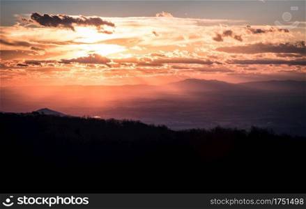 Bright sunset light fills the Shenandoah Valley during a Winter evening at Shenandoah National Park.