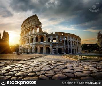 Bright sunset over Colosseum in Rome, Italy