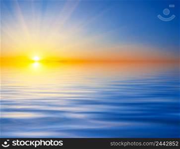 Bright sunset over the water. The lights of a sun. Travel and privacy concept. Bright sunset over the water