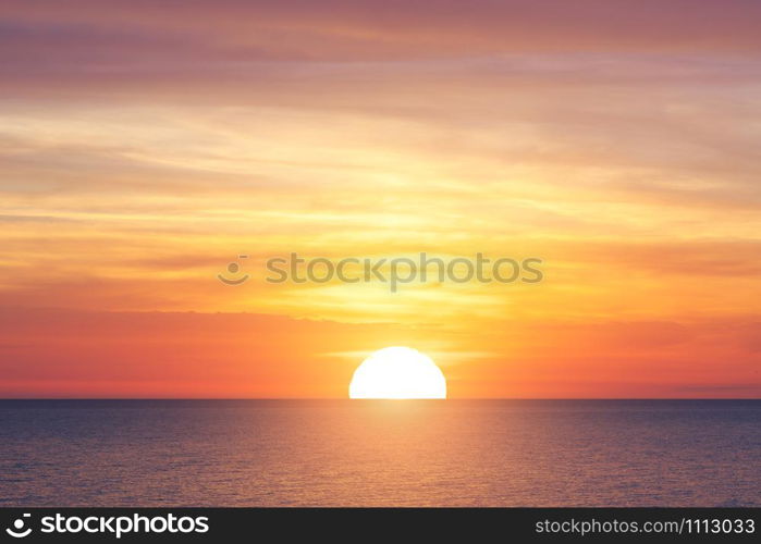 Bright sunset with large yellow sun under the sea surface