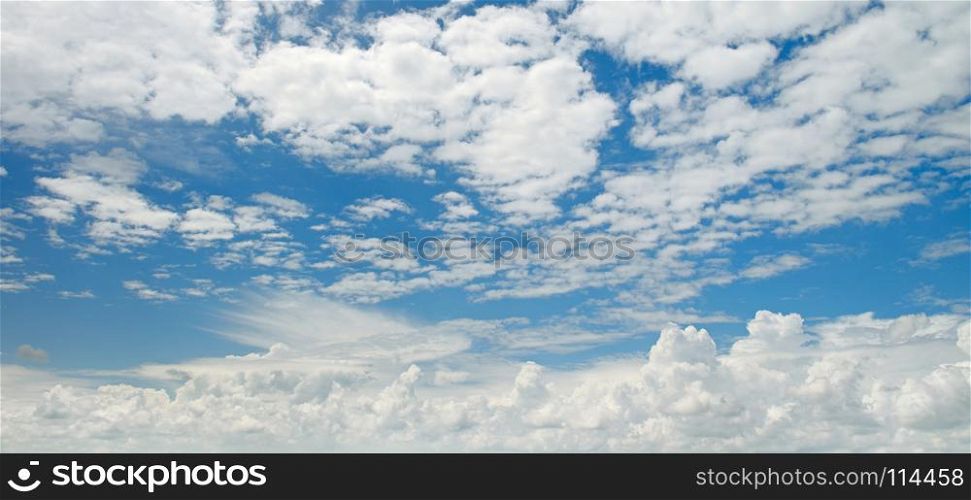 Bright white clouds on a background of blue sky.