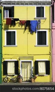 Bright yellow color house in Burano, Venice