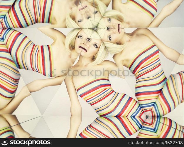 Bright young blonde in kaleidoscope of reflections