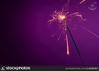 Brightly burning sparkler with copy-space.