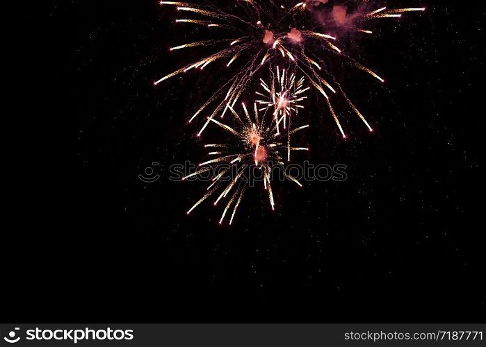 Brightly colorful fireworks and salute of various colors in the night sky background. selective focus.. Brightly colorful fireworks and salute of various colors in the night sky background. selective focus