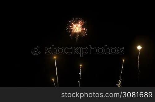 Brightly colorful fireworks for New Year and other events celebration on black background.