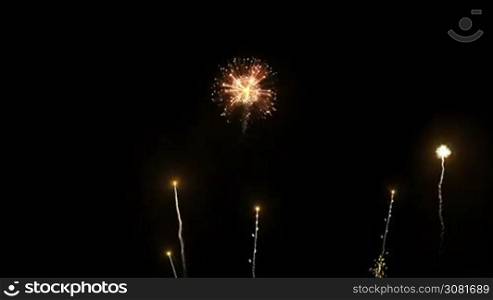 Brightly colorful fireworks for New Year and other events celebration on black background.