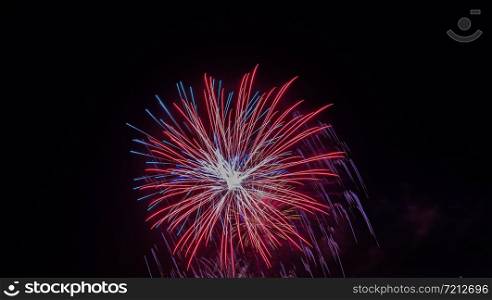 Brightly Colorful Fireworks isolated black background. New Year celebration fireworks.