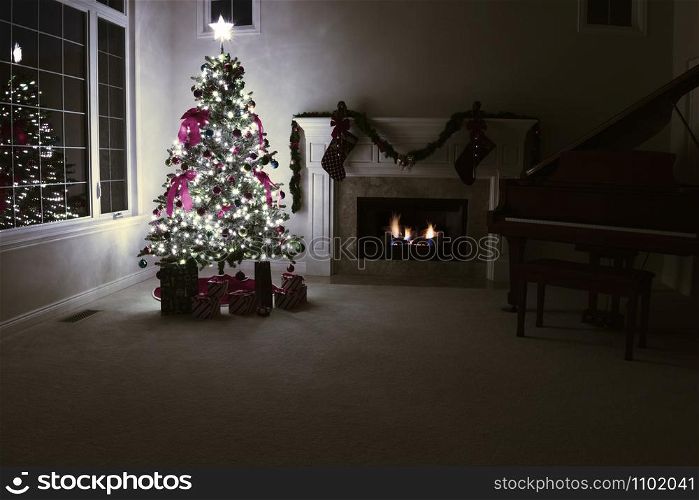 Brightly illuminated Christmas tree with glowing fireplace in home