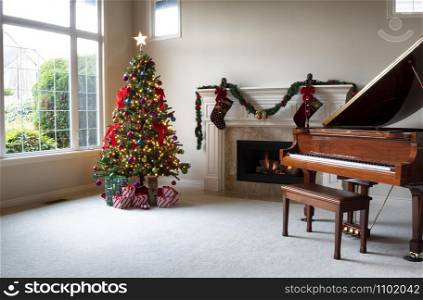 Brightly illuminated Christmas tree with glowing fireplace in home during day time