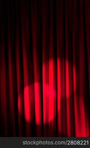 Brightly lit curtains in theatre concept