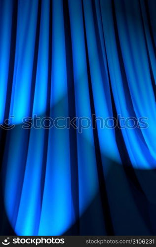 Brightly lit curtains in theatre concept